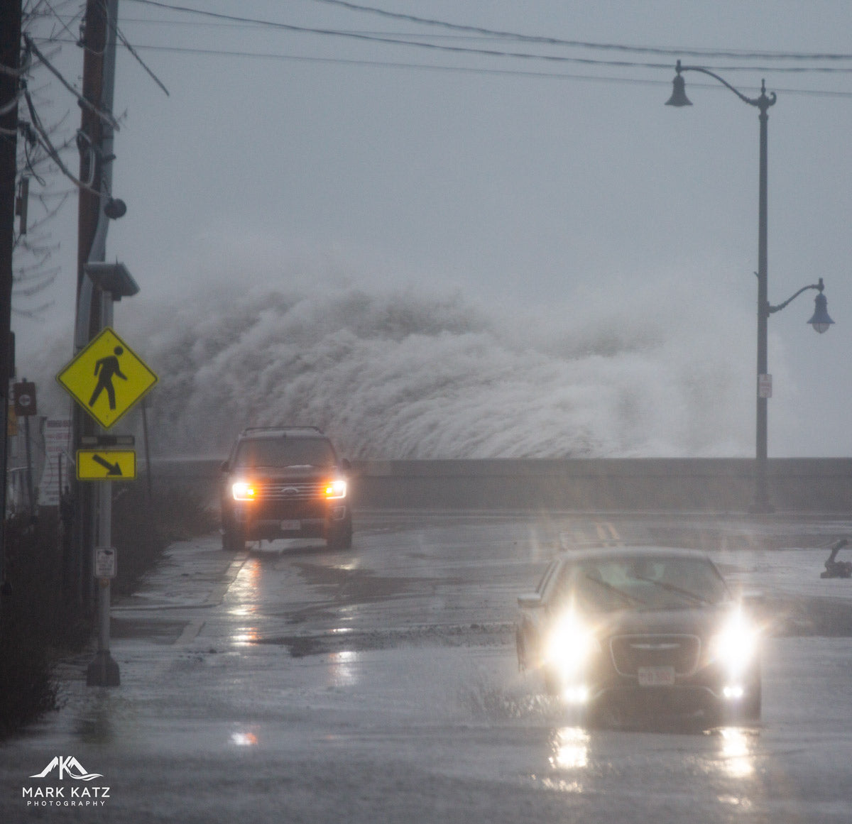 Huge waves crashing over the Causeway in Marblehead, MA