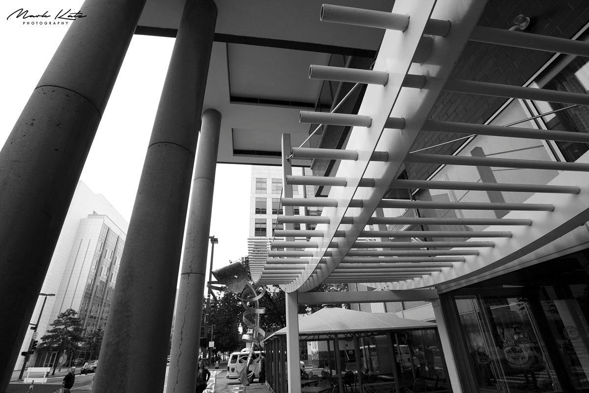 Dynamic city art evoking roller coaster motion in striking urban fine art photo.