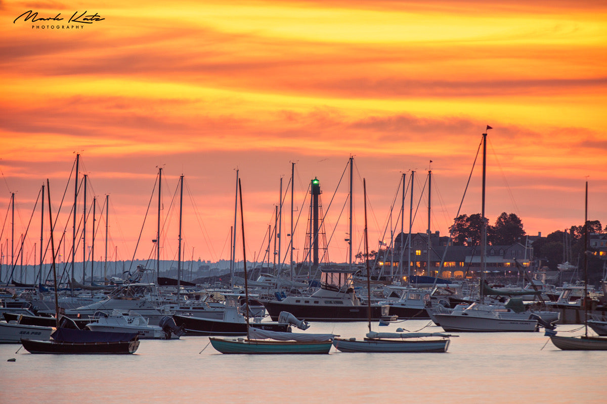 Brilliant orange sunrise over Marblehead Harbor; fine art photography for coastal decor.