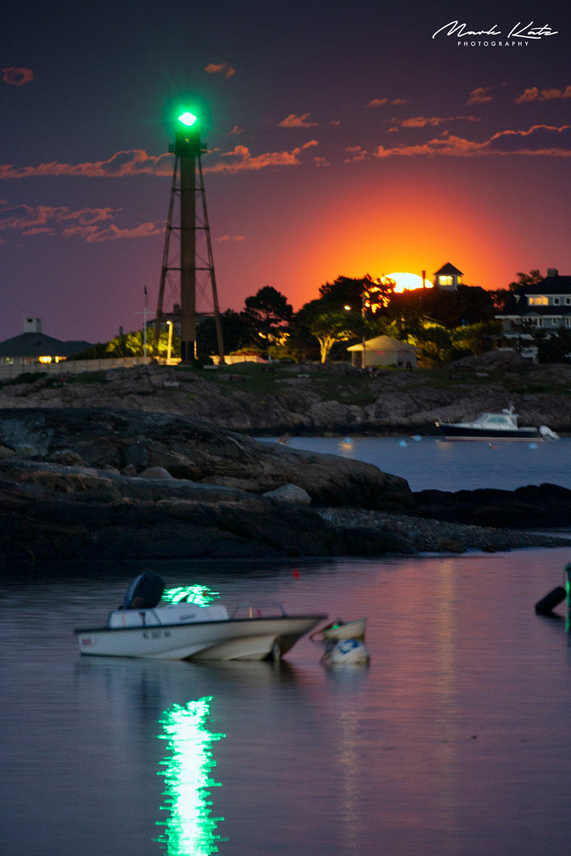 Pink strawberry moon rising over calm ocean horizon, ethereal fine art photography for seasonal decor.