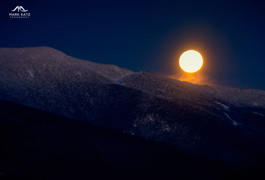 Full moon setting over the Green Mountains during arctic weather