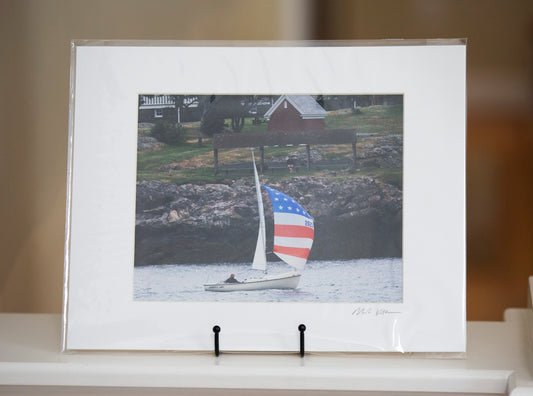 Matted print of a sailboat with an American flag in Marblehead by Mark Katz Photography