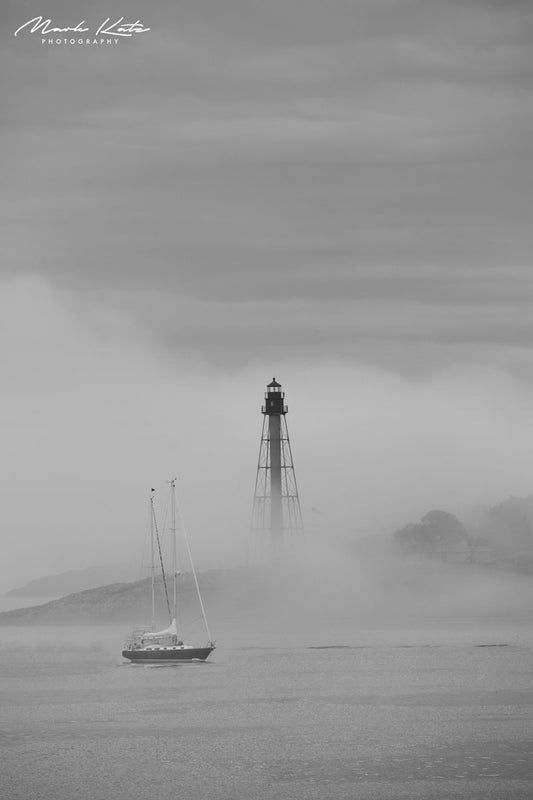 Marblehead Light cloaked in dense fog, mysterious nautical fine art photography perfect for coastal decor.