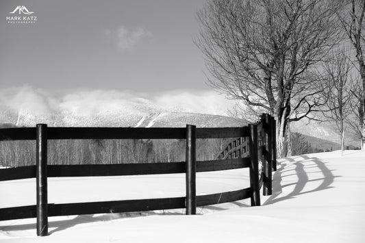 Country fence curving around snowy bend, minimalist winter landscape fine art photography print.