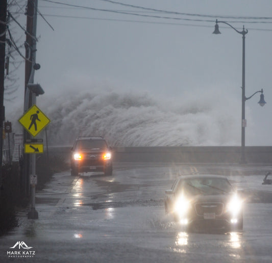 Huge waves crashing over the Causeway in Marblehead, MA