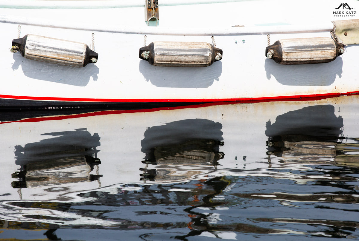 Bright buoys reflecting on calm harbor waters, nautical fine art photography perfect for marine decor.