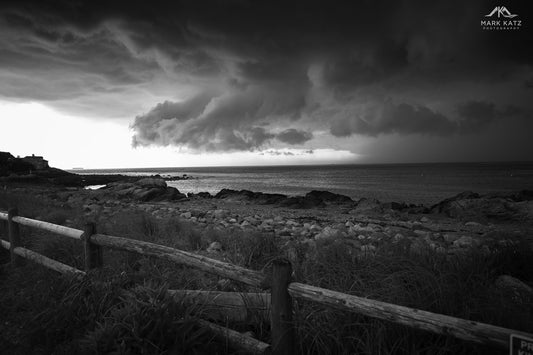 Dramatic storm clouds rolling in over ocean waves, powerful maritime fine art photography print.
