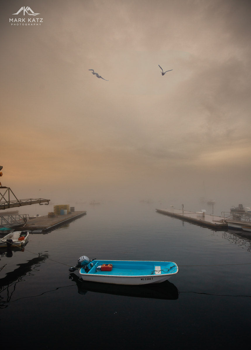 Boats floating in misty waters at sunrise, mystical morning fine art photography for serene interiors.