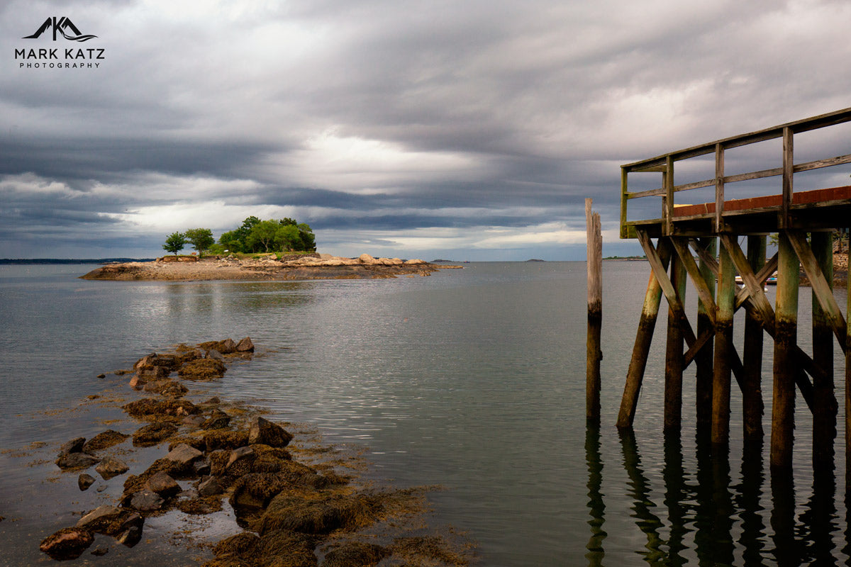Wooden pier and rock formation leading to Gerry Island in Marblehead, MA coastal fine art.