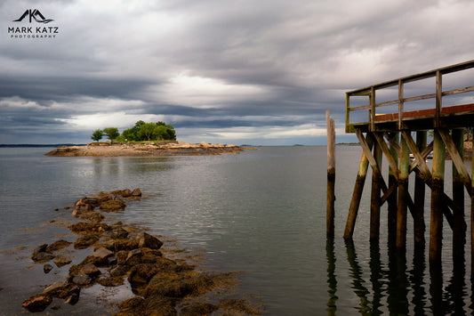 Wooden pier and rock formation leading to Gerry Island in Marblehead, MA coastal fine art.