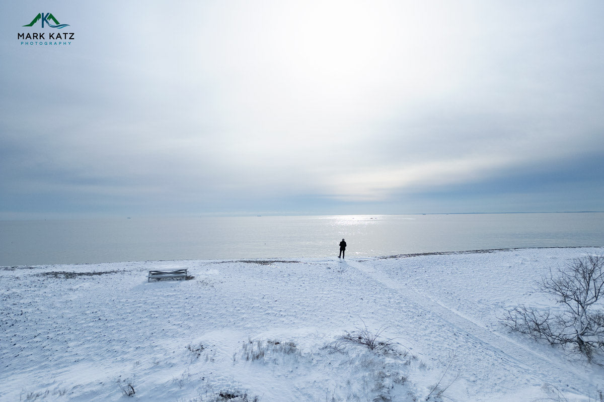 Snow-covered tundra under pale sky, minimalist arctic fine art photography by Mark Katz.