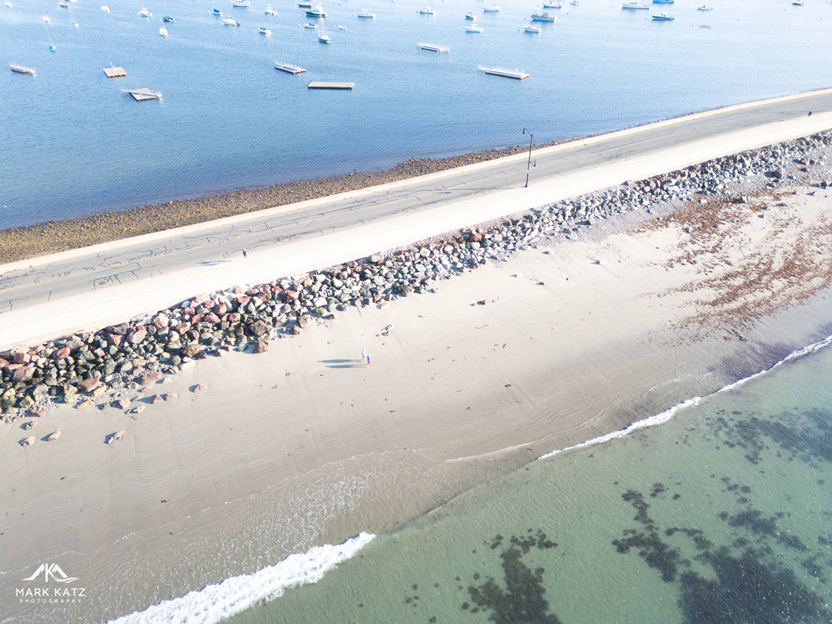 Aerial view of Marblehead Causeway with calm harbor waters, boats, and sandy shoreline – fine art coastal photography by Mark Katz Photography