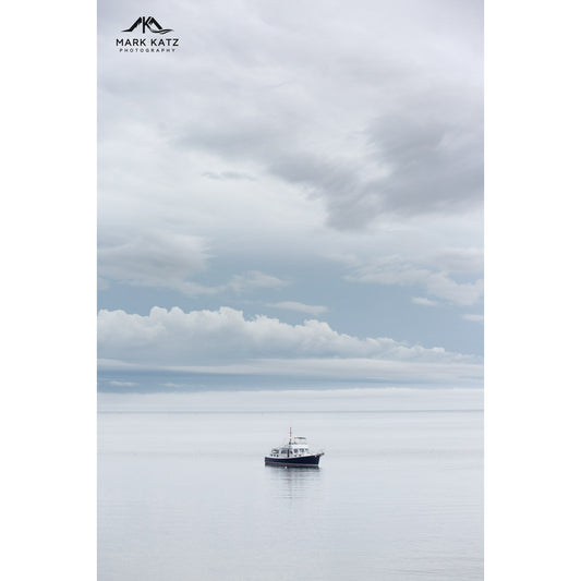 Boat in wide open ocean waters, dramatic big water country fine art seascape photography.