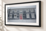 Red Door in Snow in Flat Black frame with white archival mat