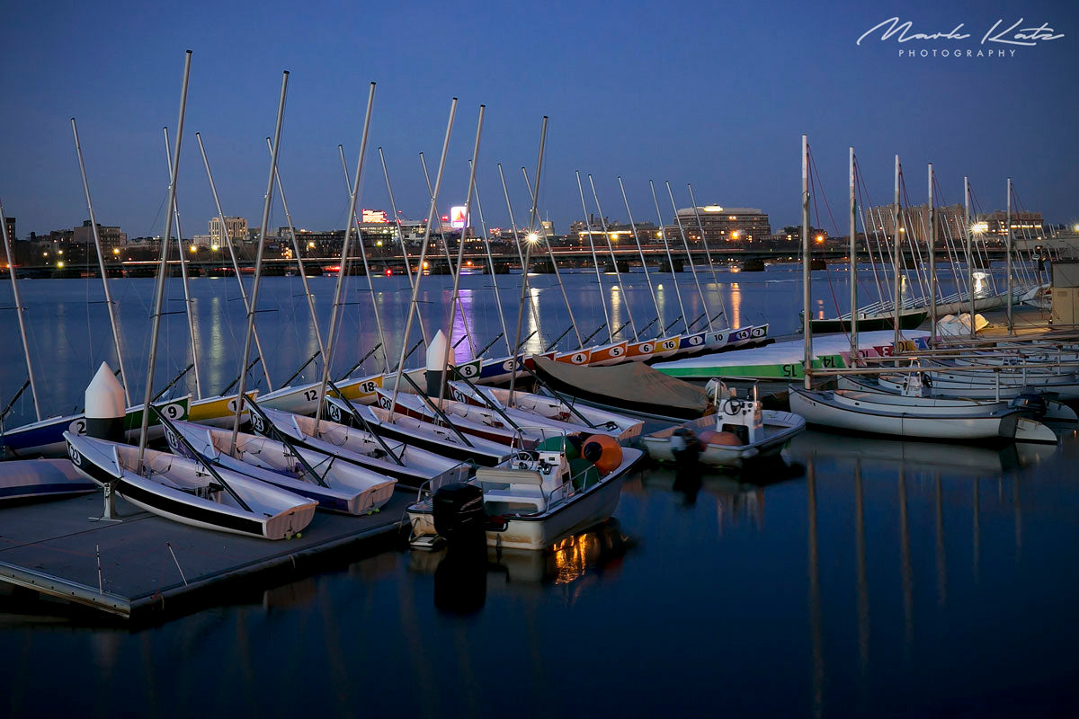 Boats lined up at dock preparing for launch, classic nautical fine art photography perfect for coastal homes.