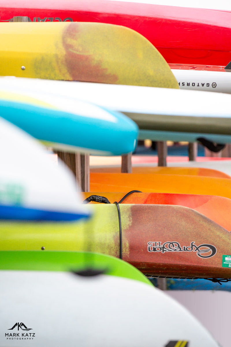 Vibrant colorful sails captured in lively maritime fine art photograph, perfect for nautical interiors.
