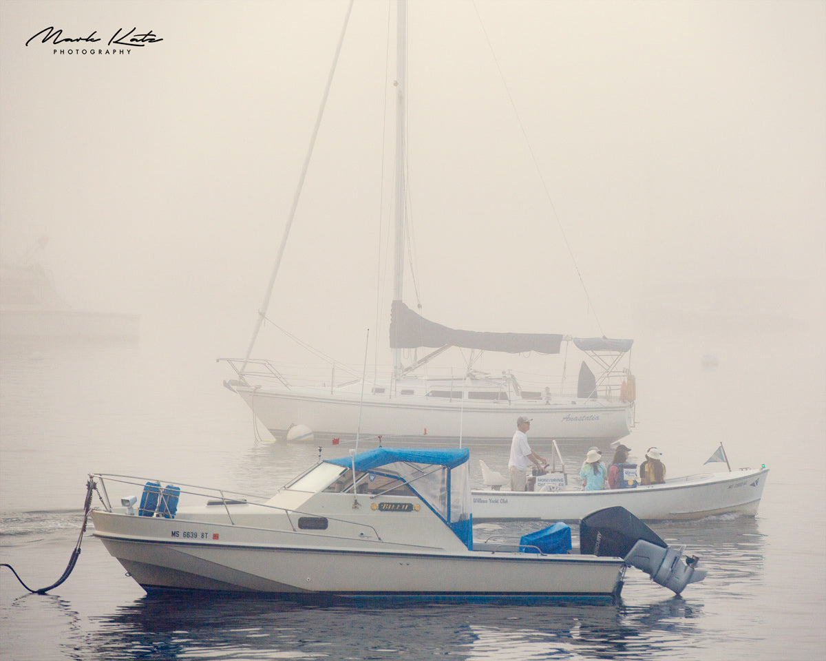 Boats obscured by thick fog, nautical fine art photography capturing scenes of limited visibility.