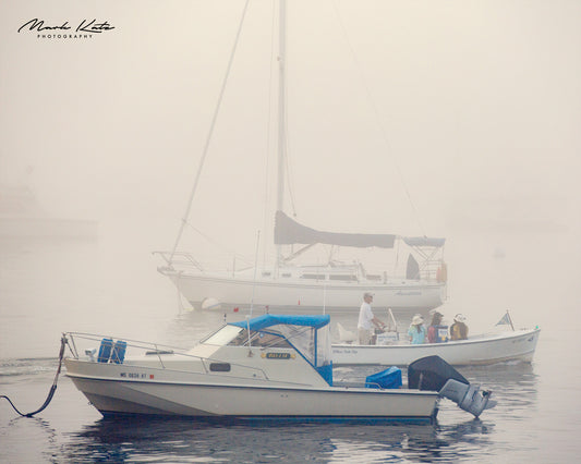 Boats obscured by thick fog, nautical fine art photography capturing scenes of limited visibility.