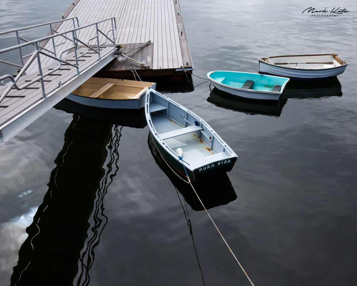 Docked boats and tropical vibes capture pura vida spirit in fine art coastal photography.