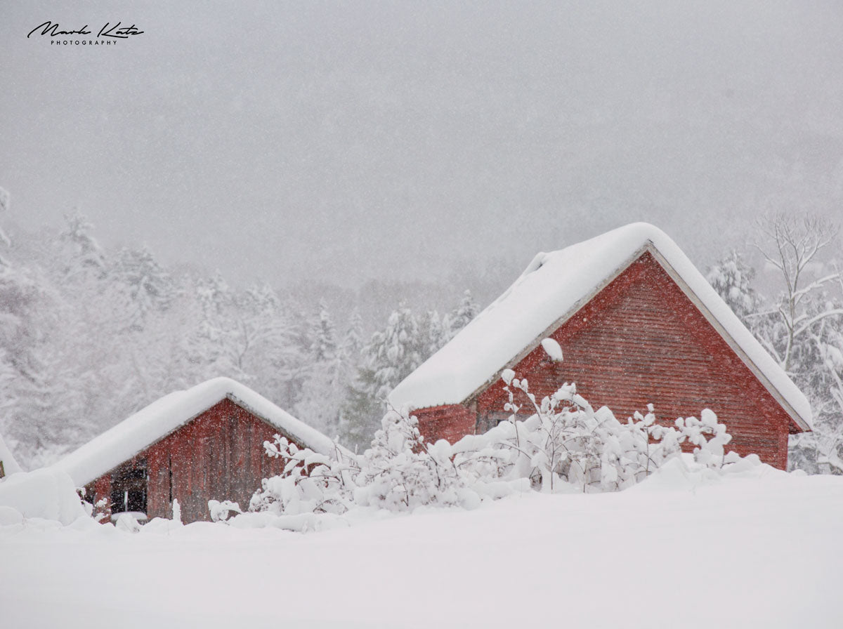 Rooftops peeking through heavy snow, striking winter fine art photograph for seasonal home decor.