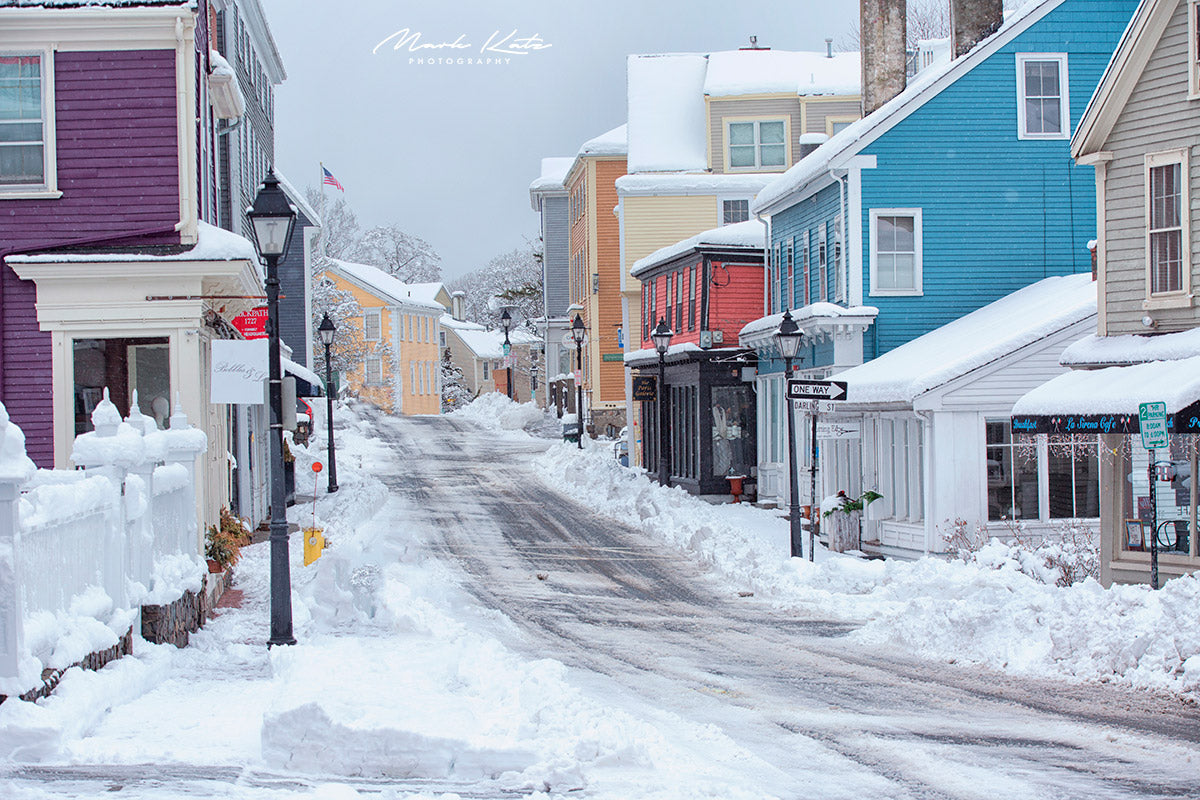 Snowy path between historic houses in Marblehead, conveying winter solitude in minimalist fine art photo.