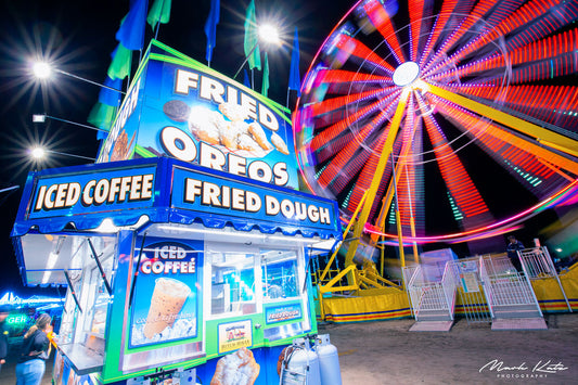 Bright carnival rides glowing near Devereux beach, playful carnival fine art photography for vibrant decor.