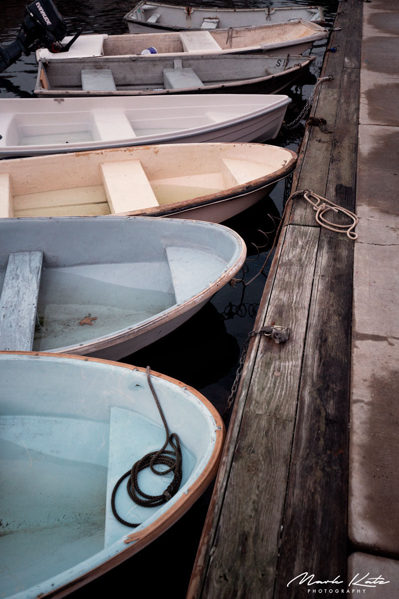 Sailboats lined up neatly in harbor, crisp nautical lineup fine art photography perfect for coastal spaces.