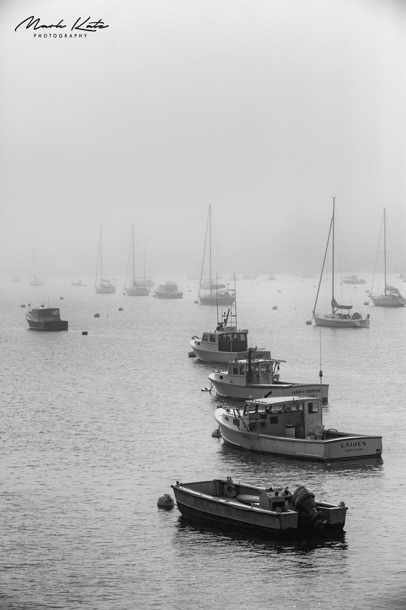 Harbor obscured under heavy fog, fine art photography depicting scenes of low visibility at sea.