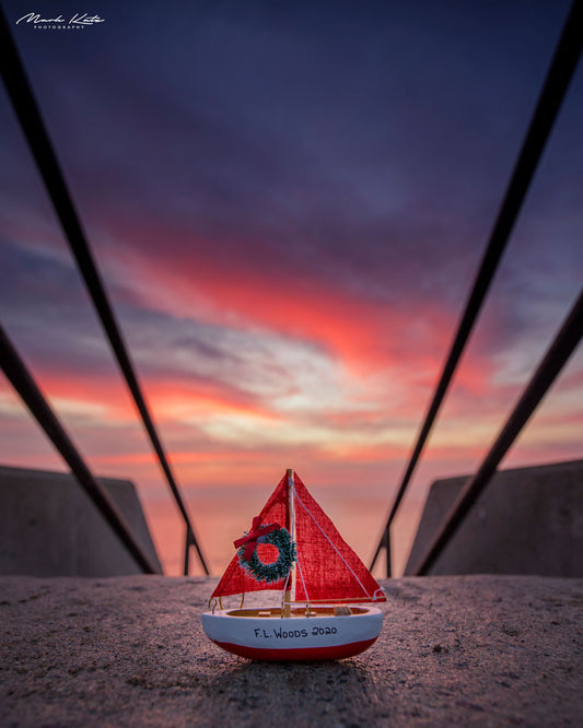 FL Woods mini sailboat under vivid sunset skies; fine art photography for maritime decor.