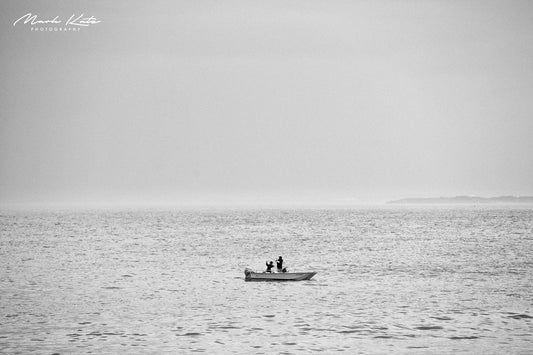 Fishing in a small boat, black and white minimalist tone