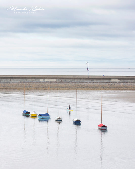 Racer's Row sailboats aligned in calm waters, minimalist alignment fine art nautical photography.