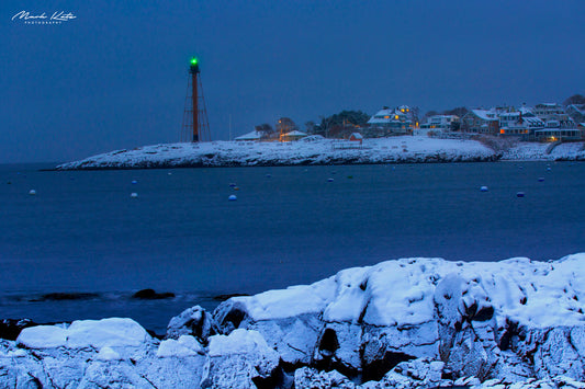 Snow covering rugged coastal rocks, dramatic winter seascape fine art photography for coastal homes.