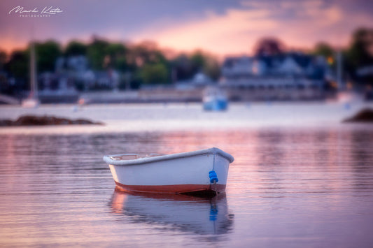 Soft pastel glow illuminating coastal harbor at dawn, peaceful morning glow nautical fine art photography.